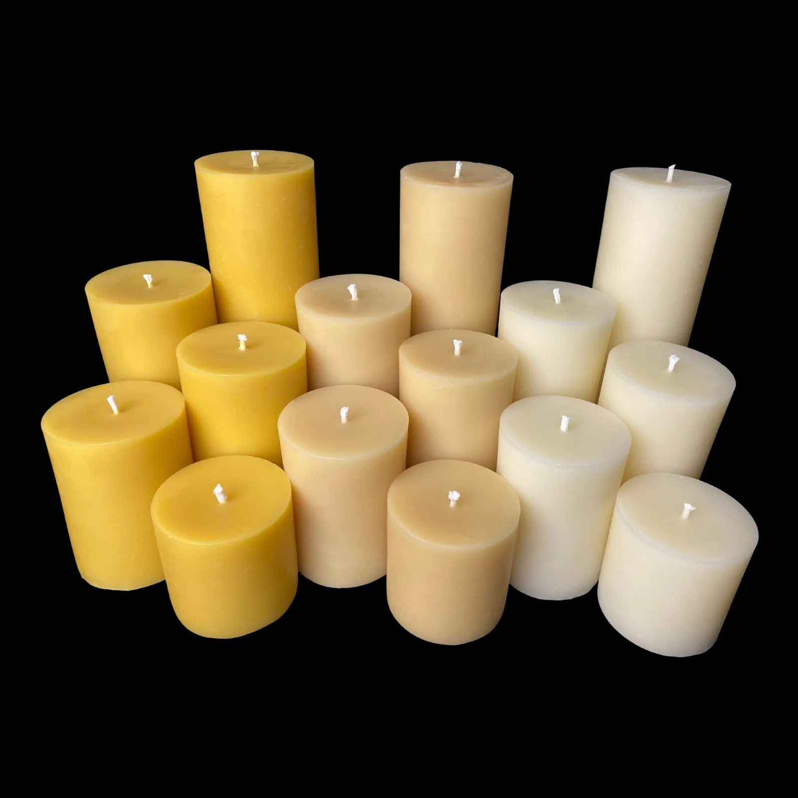 Bulk 3" beeswax pillar candles in yellow, ivory, and beige, ideal for large gatherings or resale.