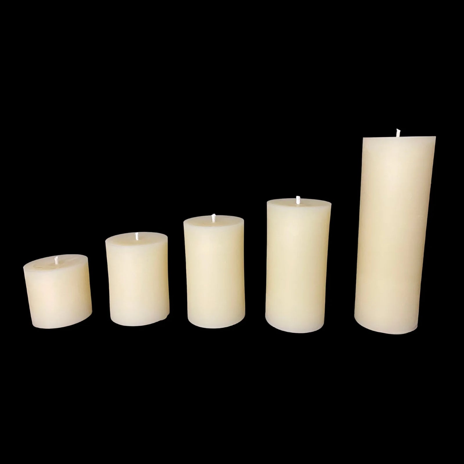 Tall white beeswax pillar candles in various sizes with a 3 in diameter.