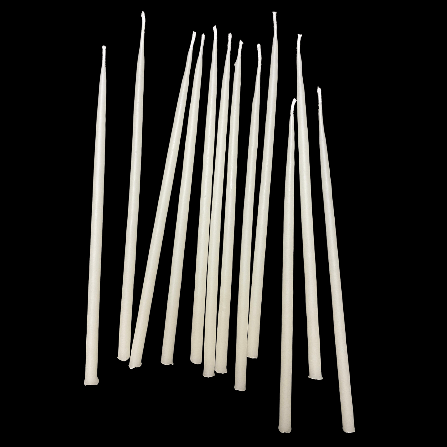 Six inch white beeswax birthday taper candles standing together hand poured by beekeepers
