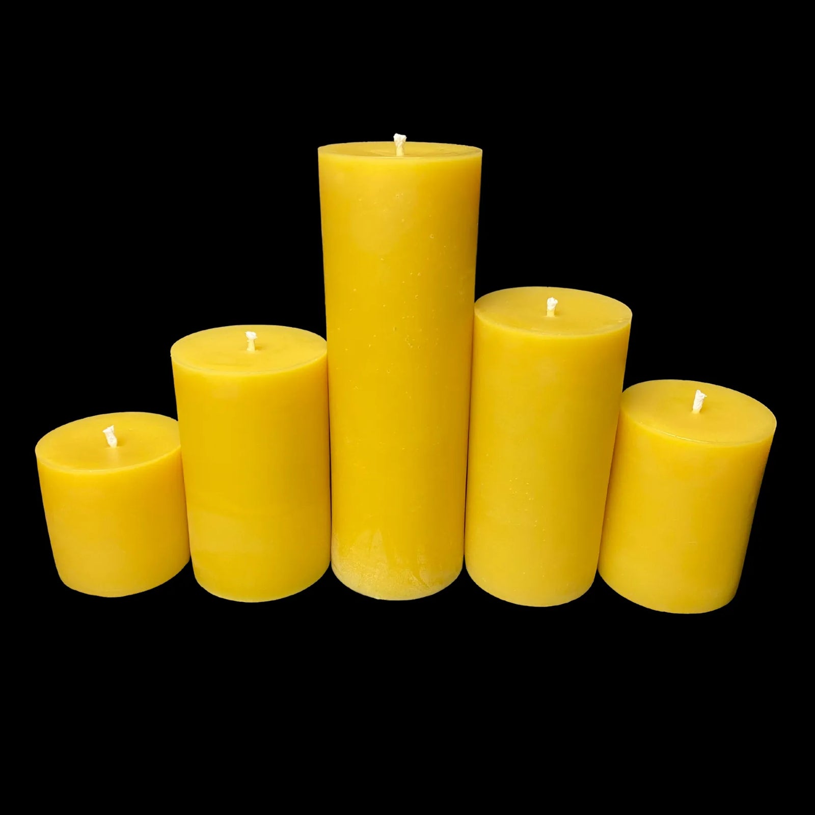 Five yellow beeswax pillar candles, handmade for cozy spaces, dining tables, or eco-style gifting.