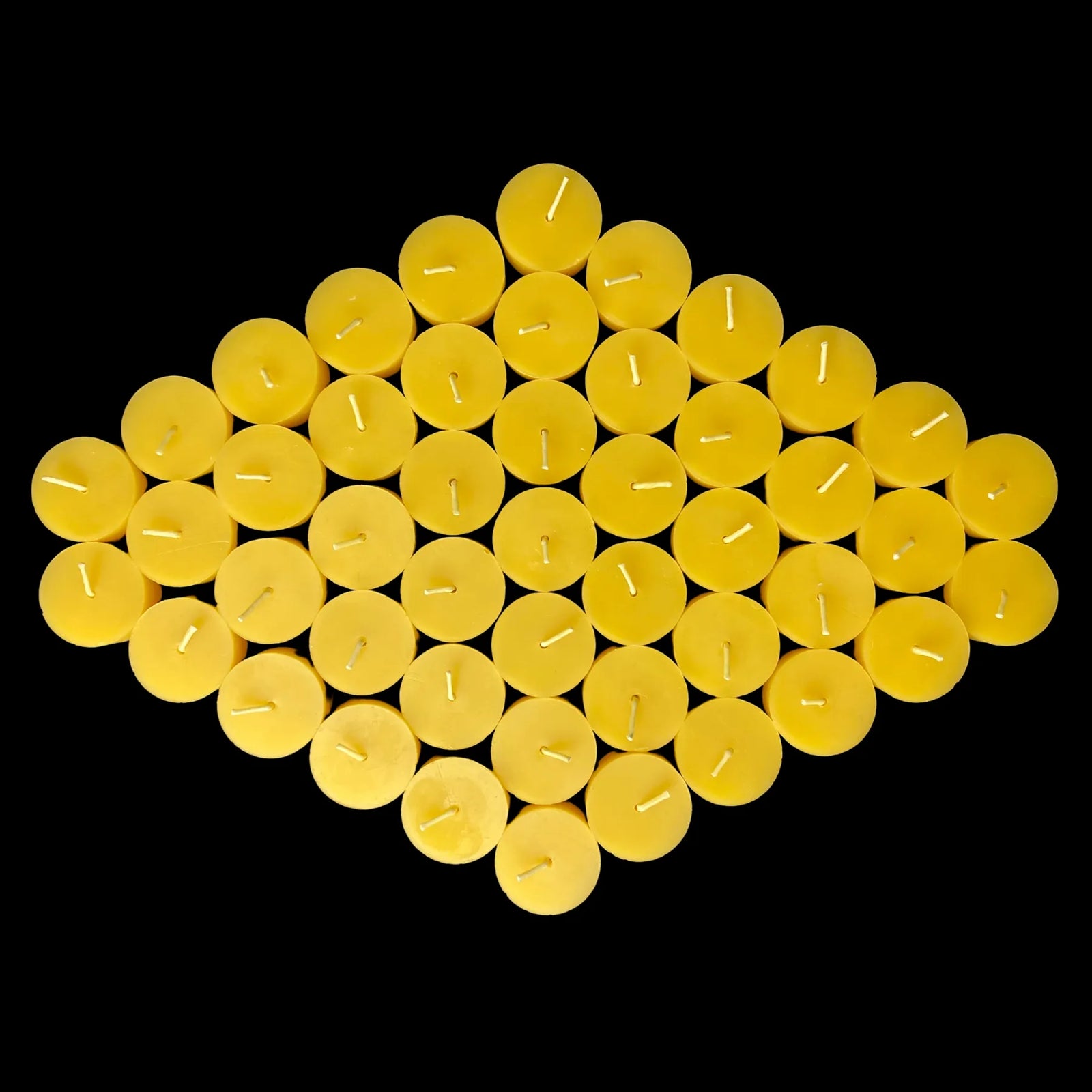 Yellow beeswax tea lights in a diamond, sold in sets up to 96, pure beeswax
