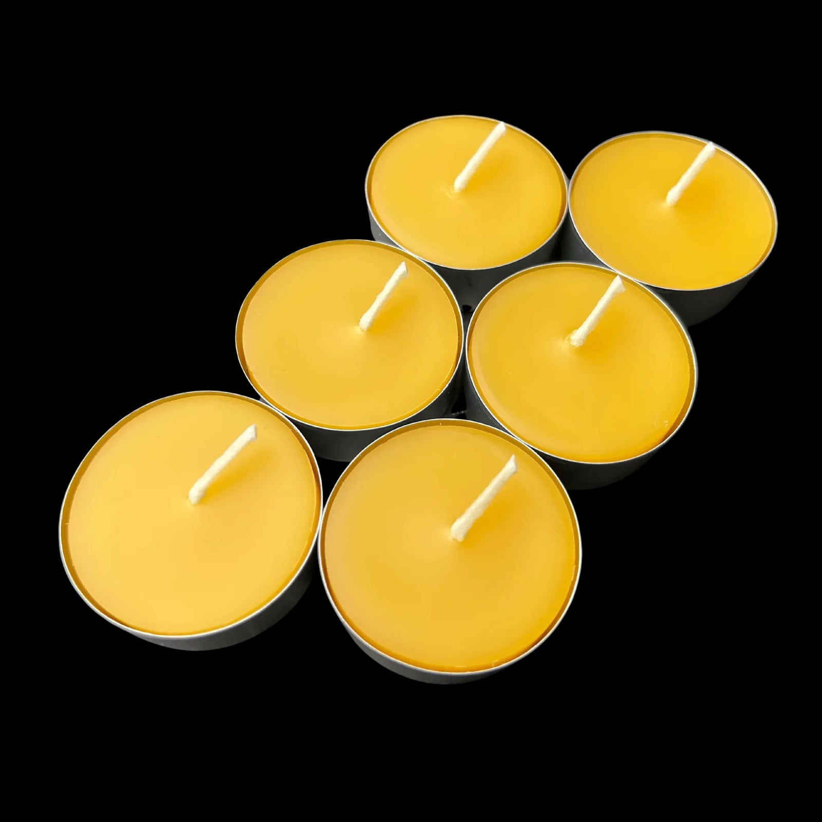 Vivid yellow beeswax tea lights in aluminum cups, set of 6, rich golden color