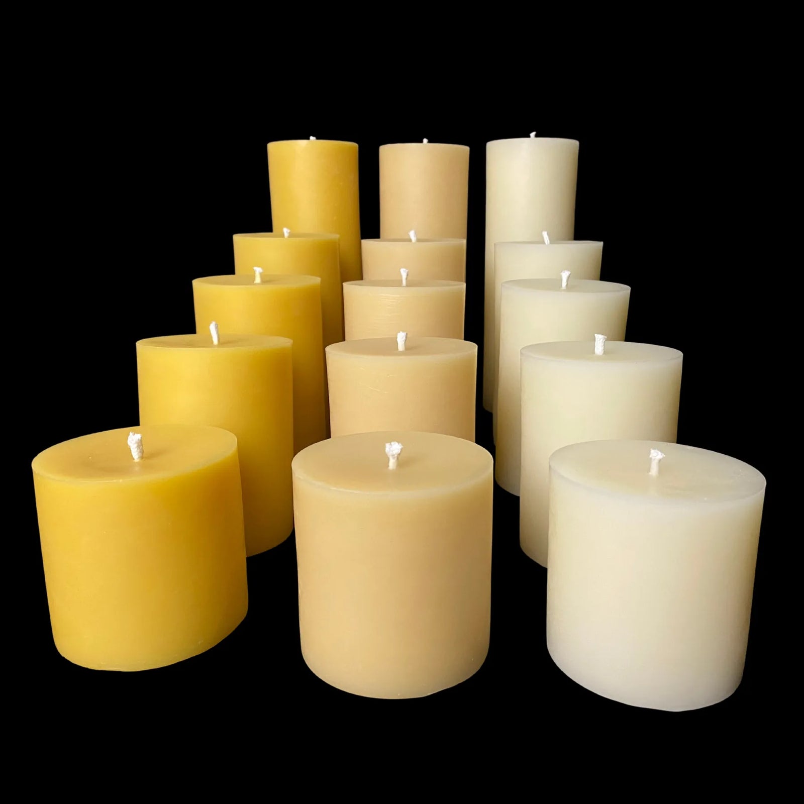 Pure 100% beeswax pillar candles in varied heights, perfect for rustic charm or gift giving.