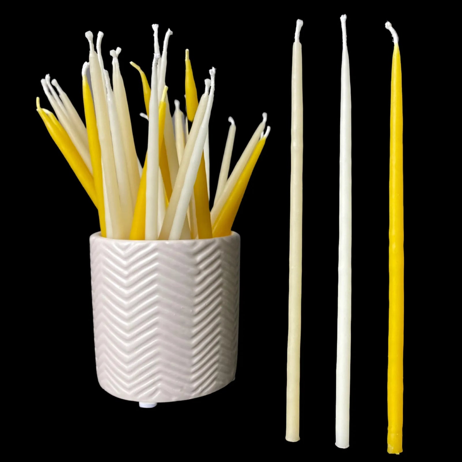 Beeswax birthday taper candles in white yellow and cappings with a ceramic vessel