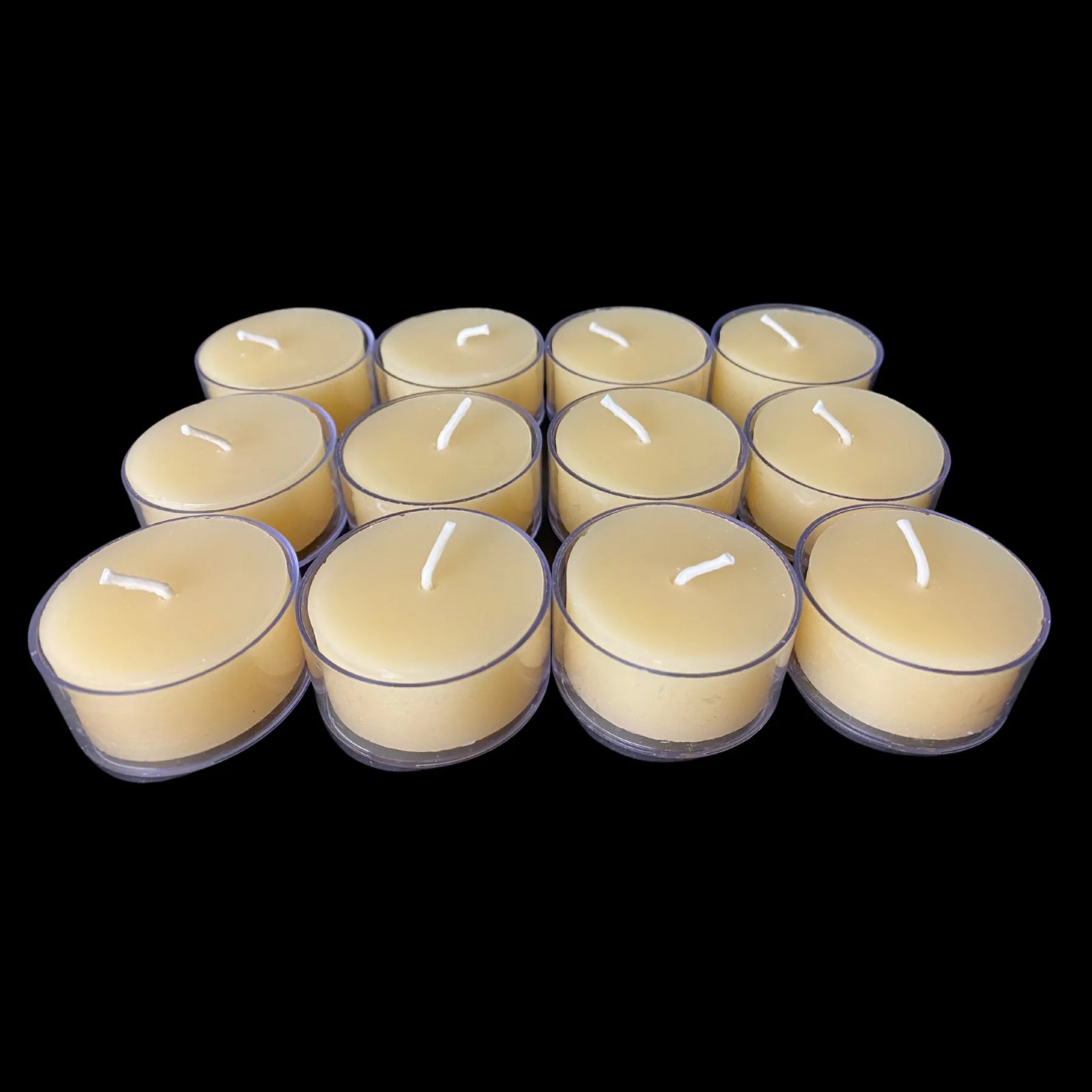 Natural cappings beeswax tea lights in clear cups, creamy honey tone, set of 12