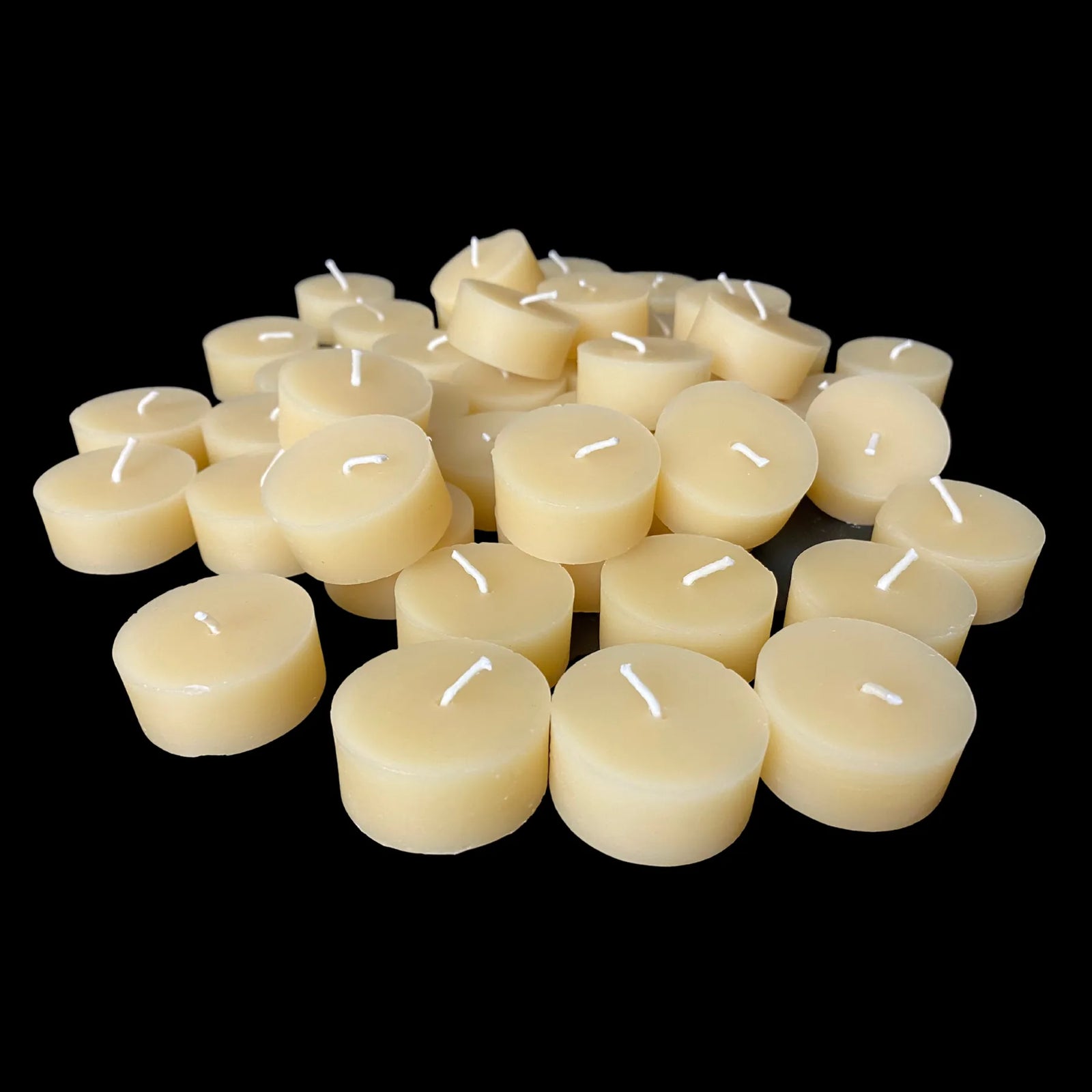 Cappings beeswax tea light refills in a low pile, hand poured with cotton wicks