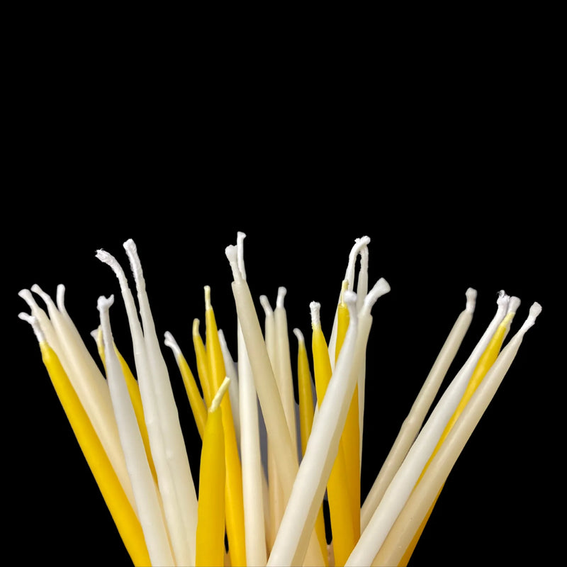 Assorted 6 inch birthday candles in white yellow and natural cappings beeswax