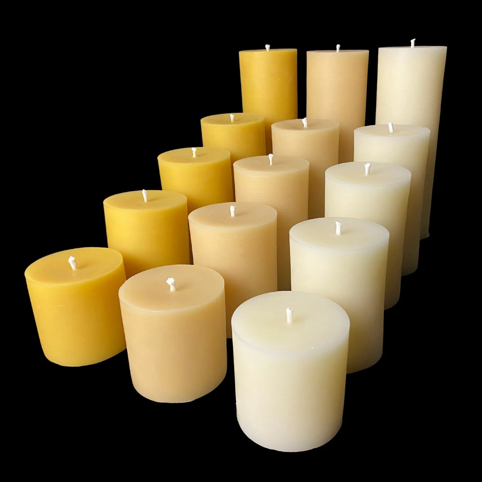 Mixed beeswax candle set in yellow, white, and cappings tones, ideal for large displays or gifting.