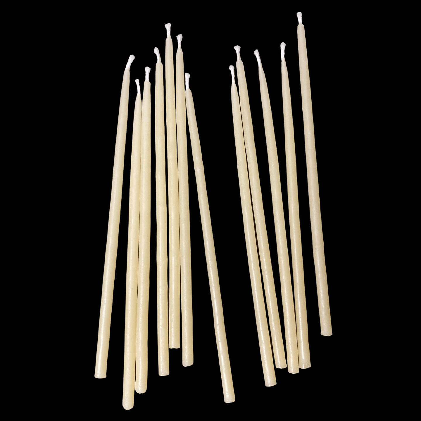 Six inch cappings beeswax birthday taper candles leaning together hand poured by beekeepers