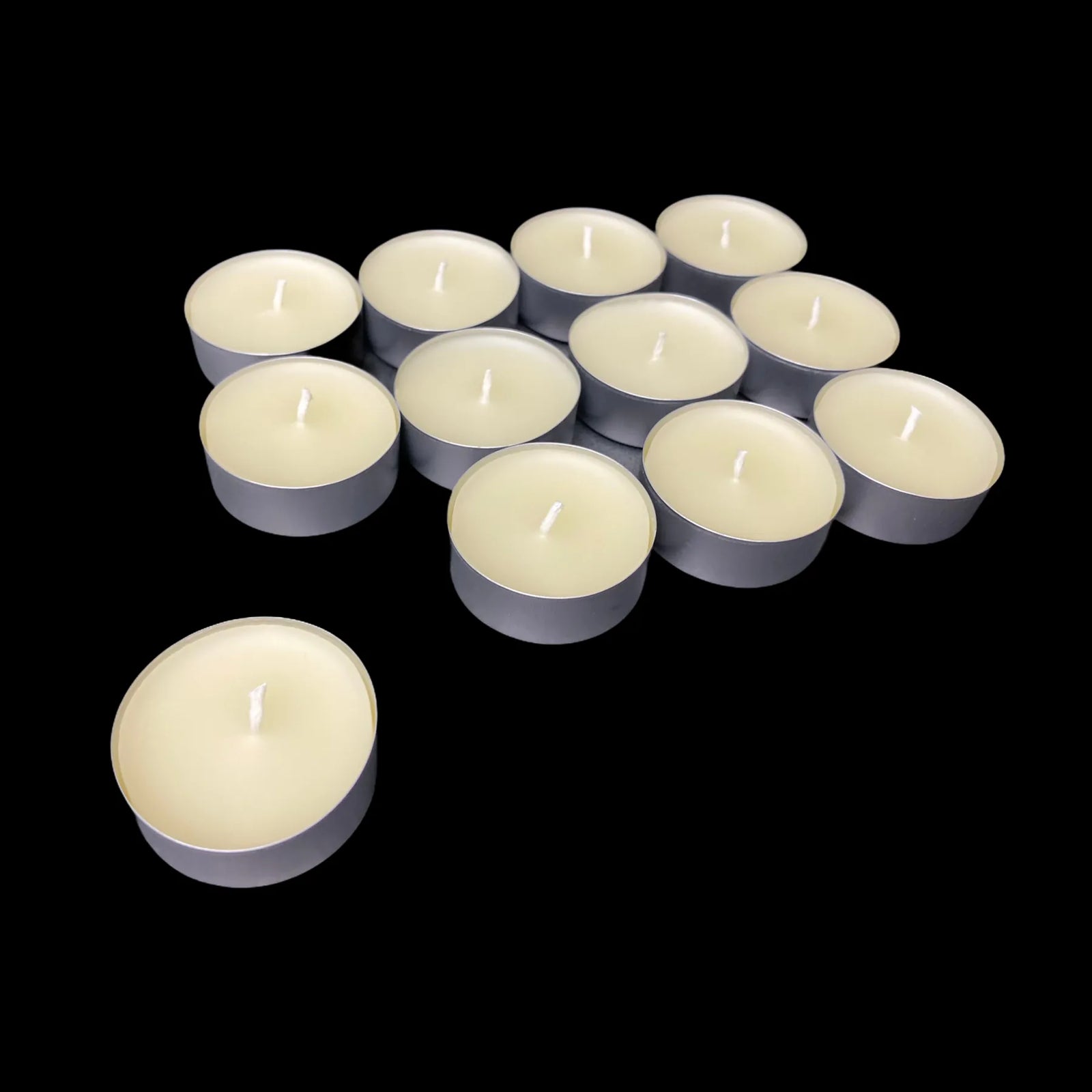Pure white beeswax tea lights in aluminum cups in a loose cluster, 1.48" wide
