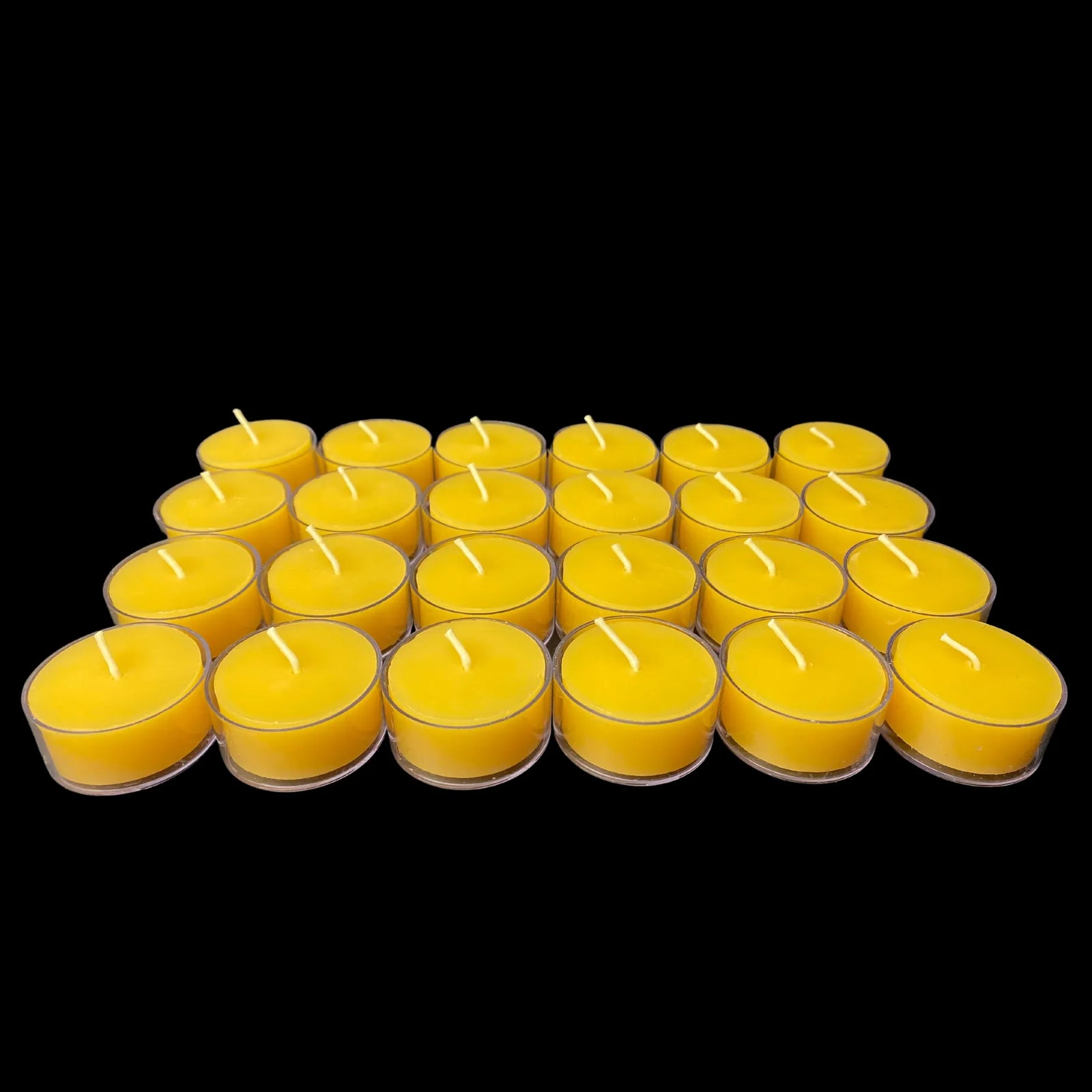 Yellow beeswax tea lights in clear cups in a low grid, set of 24, 1.5 in