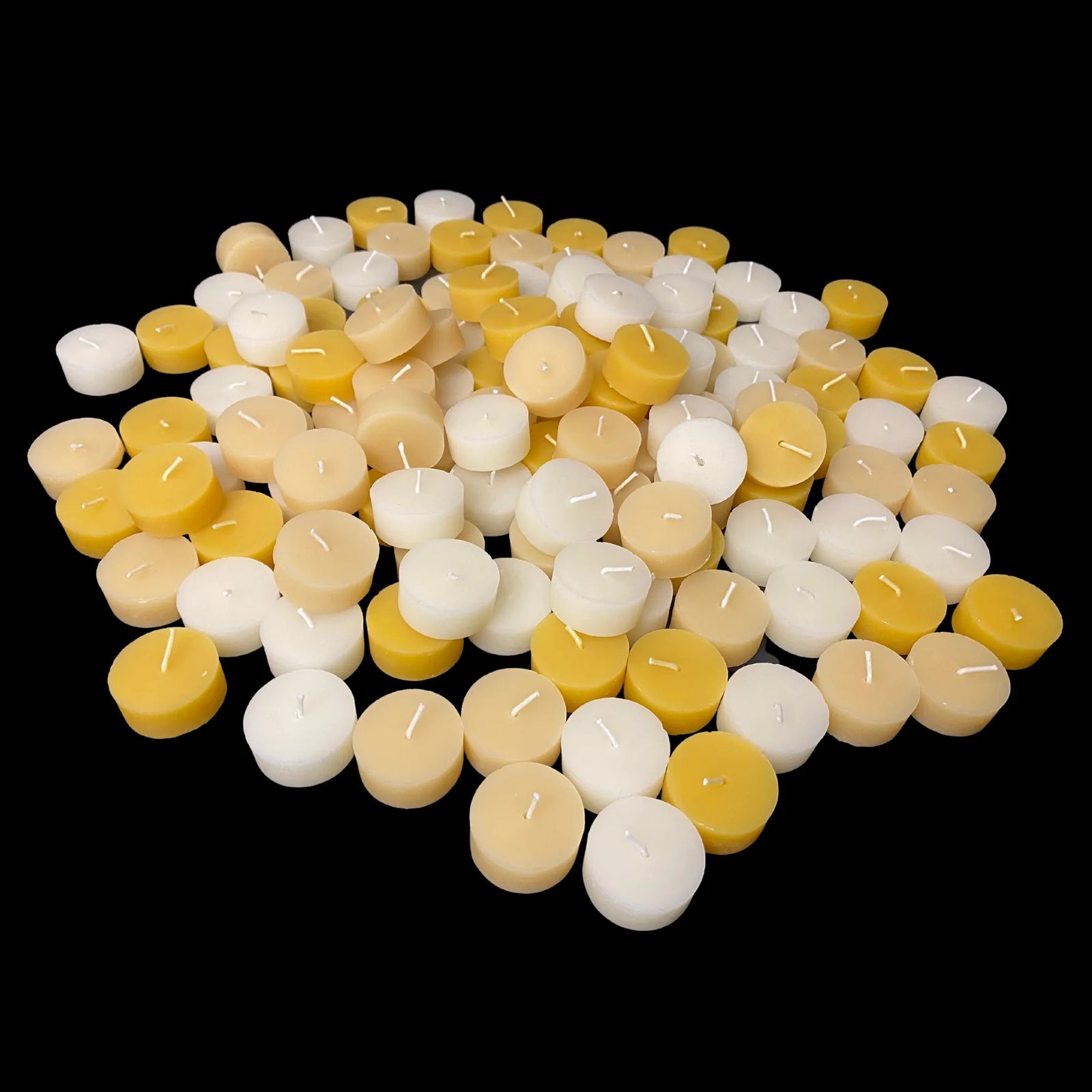 Yellow, white and cappings beeswax tea lights in a low cluster, made in USA